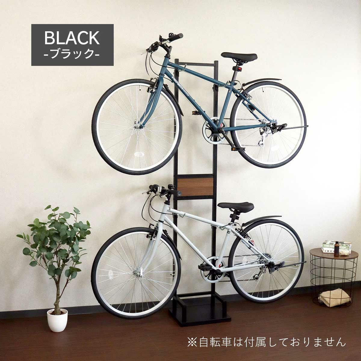 ブラックの自転車スタンドが室内に置かれているイメージ画像。スタンドには自転車が2台かけられている。
